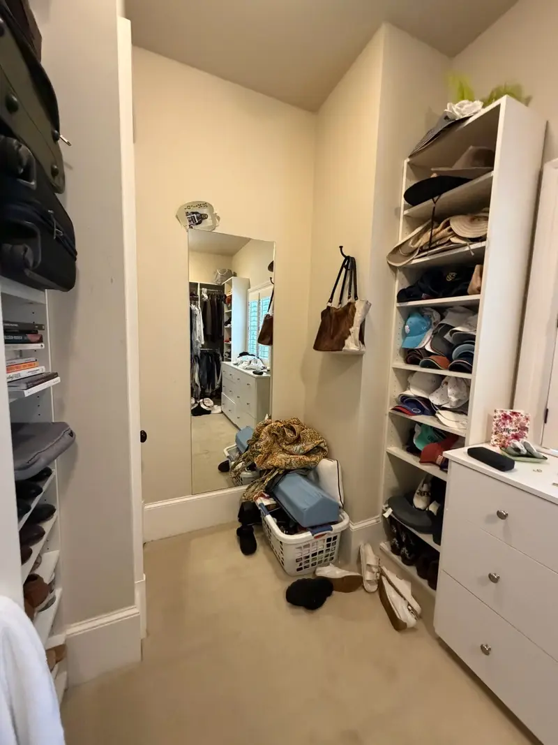 Before: a walk-in closet from a north atlanta whole-home project